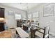 Bright dining area with glass table and bench seating at 19322 Autumn Chase Ct, Land O Lakes, FL 34638