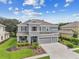 Two-story house with well-manicured landscaping at 19322 Autumn Chase Ct, Land O Lakes, FL 34638