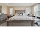 Large main bedroom with a king-size bed and ensuite bathroom at 19322 Autumn Chase Ct, Land O Lakes, FL 34638