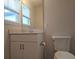 Small bathroom with single vanity, toilet and mirror at 19639 Shady Oak Dr, Land O Lakes, FL 34638