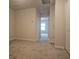 Bedroom with carpet and view into hallway at 19639 Shady Oak Dr, Land O Lakes, FL 34638