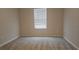 Simple bedroom with carpet and window with blinds at 19639 Shady Oak Dr, Land O Lakes, FL 34638