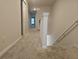 Upstairs hallway with carpet and access to bedrooms at 19639 Shady Oak Dr, Land O Lakes, FL 34638