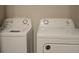 Laundry room with side-by-side washer and dryer at 19639 Shady Oak Dr, Land O Lakes, FL 34638