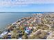 Waterfront property shown in wide aerial view at 1964 Cedar Dr, Dunedin, FL 34698