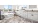 Luxurious bathroom with soaking tub and double vanity at 1964 Cedar Dr, Dunedin, FL 34698