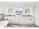 Bathroom boasts double vanity, granite countertops, and an updated look at 1964 Cedar Dr, Dunedin, FL 34698