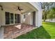 Covered patio with tile flooring and ceiling fan at 1964 Cedar Dr, Dunedin, FL 34698