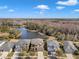 Aerial view of a house and neighborhood with a lake at 20209 Merry Oak Ave, Tampa, FL 33647