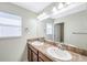 Bathroom with double vanity and granite countertop at 20209 Merry Oak Ave, Tampa, FL 33647