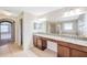 Double vanity bathroom with granite countertop at 20209 Merry Oak Ave, Tampa, FL 33647