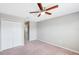 Bedroom with double door closet and ceiling fan at 20209 Merry Oak Ave, Tampa, FL 33647