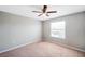 Spacious bedroom with a window and ceiling fan at 20209 Merry Oak Ave, Tampa, FL 33647