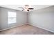 Simple bedroom with ceiling fan and window at 20209 Merry Oak Ave, Tampa, FL 33647