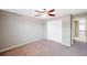 Bedroom with double door closet and ceiling fan at 20209 Merry Oak Ave, Tampa, FL 33647