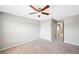 Bedroom with double door closet and ceiling fan at 20209 Merry Oak Ave, Tampa, FL 33647