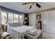 Comfortable bedroom featuring a window and a ceiling fan at 20490 Pinewood Dairy Rd, Brooksville, FL 34601