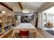 Dining room showcasing an open layout, custom lighting, and views into kitchen at 20490 Pinewood Dairy Rd, Brooksville, FL 34601