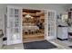 Dining area with french door entryway and decorative light fixtures at 20490 Pinewood Dairy Rd, Brooksville, FL 34601