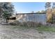 Exterior shot of a metal building, surrounded by grass and trees at 20490 Pinewood Dairy Rd, Brooksville, FL 34601