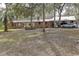 Ranch style brick home with metal roof and large lot at 20490 Pinewood Dairy Rd, Brooksville, FL 34601