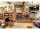 Living room showcasing a prominent brick fireplace with decorative mantle and hearth at 20490 Pinewood Dairy Rd, Brooksville, FL 34601