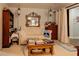 Living room featuring a sofa, mirror and stacked books at 20490 Pinewood Dairy Rd, Brooksville, FL 34601