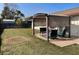 Backyard with pergola, seating, and a view of the yard and fence at 2134 Victory Ave, Largo, FL 33770