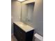 Bathroom featuring modern vanity with storage and large mirror at 2134 Victory Ave, Largo, FL 33770