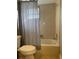 Full bathroom with tile floors and shower/bath combo with curtain at 2134 Victory Ave, Largo, FL 33770