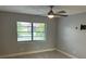 Bedroom with a ceiling fan, and a large window offering plenty of natural light at 2134 Victory Ave, Largo, FL 33770