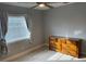 Bedroom with dresser, a window with blinds, and ample natural light at 2134 Victory Ave, Largo, FL 33770