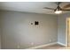 Bedroom featuring ceiling fan, neutral wall color, and mounted TV bracket at 2134 Victory Ave, Largo, FL 33770