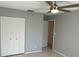 Bedroom featuring tiled floors, a ceiling fan, and a closet for ample storage at 2134 Victory Ave, Largo, FL 33770