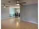 Bright, open living area with tile floors, ceiling fans, and dining area beyond at 2134 Victory Ave, Largo, FL 33770