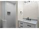 Modern bath boasts white marble vanity and glass shower with subway tile and mosaic nook at 2186 Coffee Pot Ne Blvd, St Petersburg, FL 33704