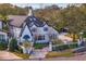 Charming two-story home with a black gated entrance, brick driveway, and well-manicured landscaping at 2186 Coffee Pot Ne Blvd, St Petersburg, FL 33704