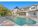 A luxurious pool with fountains and an elegant patio, perfect for outdoor entertaining at 2186 Coffee Pot Ne Blvd, St Petersburg, FL 33704