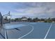 Outdoor community basketball court with well-maintained blue surface and basketball hoops at 2311 Wellesley, Bradenton, FL 34207