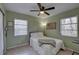 Comfortable bedroom with a ceiling fan, natural light, and neutral decor at 2311 Wellesley, Bradenton, FL 34207