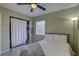 A cozy bedroom featuring a ceiling fan and natural light at 2311 Wellesley, Bradenton, FL 34207