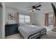 Bright bedroom with a ceiling fan, large window, and a classic dresser, creating a cozy and inviting atmosphere at 2311 Wellesley, Bradenton, FL 34207