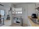 Bright kitchen featuring tiled flooring and a pass-through window to the main living area at 2311 Wellesley, Bradenton, FL 34207