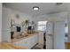 Bright kitchen features white cabinetry, butcher block counters, and stainless steel appliances at 2311 Wellesley, Bradenton, FL 34207