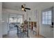 The kitchen and dining area offer tile floors, access to the screened-in patio, and a ceiling fan at 2311 Wellesley, Bradenton, FL 34207