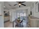 Kitchen and dining area with tiled floors, access to the screened-in patio, and modern appliances at 2311 Wellesley, Bradenton, FL 34207