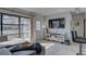 Sunlit living room showcasing large windows, modern furnishings, and a view of the outdoors at 2311 Wellesley, Bradenton, FL 34207