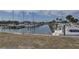 Community marina with multiple boats docked in an orderly fashion on a sunny day at 2311 Wellesley, Bradenton, FL 34207