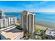 High-rise building near waterfront with city in background at 2413 Bayshore Blvd # 1004, Tampa, FL 33629