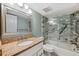 Bathroom with granite countertop and walk-in shower at 2413 Bayshore Blvd # 1004, Tampa, FL 33629